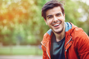 Portrait of smiling young man outdoors